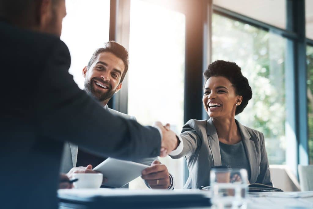 Happybusinesspeoplehandshakeandmeetinginteamworkforpartnershiporcollaborationinboardroomwomanpersonshakinghandsinteamrecruitingintroductionorb2bagreementattheworkplace